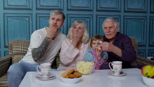 Multigenerational Family Watch TV with Young Girl Kid at Home Getting Scared Watching Horror Movie alt