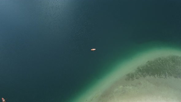 Aerial view moving fishing boats at the lake. Aerial view fishing motor boat. Ocean sea water wave