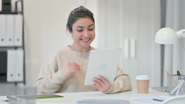 Indian Woman Talking on Video Chat on Tablet alt