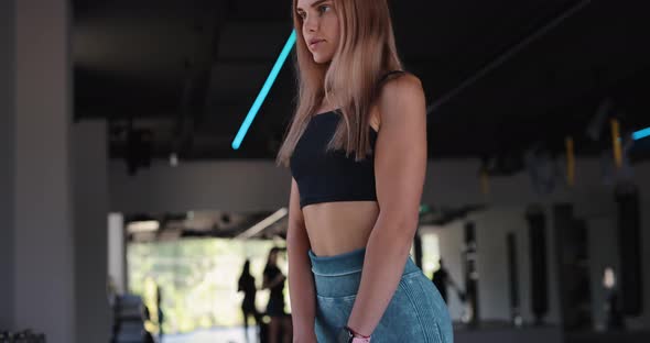 Young Woman Make Kettlebell Deadlift in a Gym alt