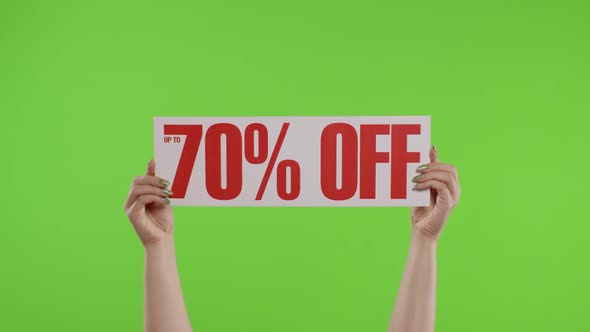 70 Percent Off Advertisement Inscription on Paper Sheet in Womans Hands on Chroma Key. Slow Motion alt