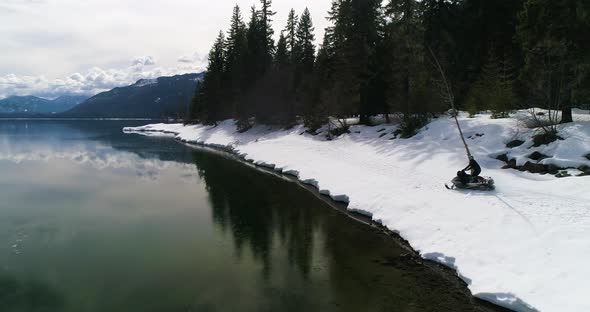 Snowmobiling Side Of Forest Lake Shore Nature Surroundings Winter Recreation alt