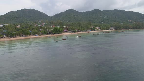 Thailand Beach with many Boats alt