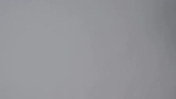 Clapper board. Close up hand and film making clapperboard isolated on background studio. alt