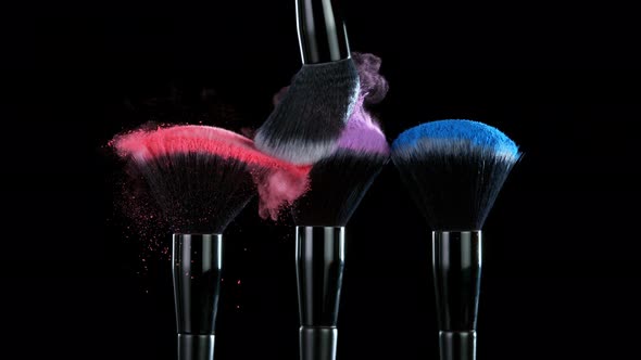 Super Slow Motion Shot of Colorful Powder and Makeup Brushes Touch Each Other at 1000 Fps alt