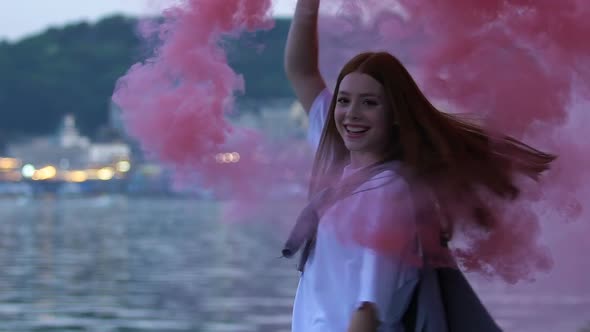 Excited Female Teen Dancing With Color Smoke Bomb, Enjoying Youth Freedom, Fun alt