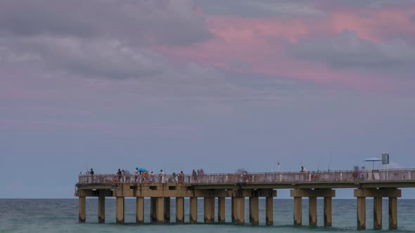 Full moon rise over pier in Miami alt