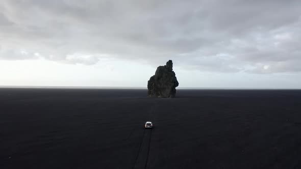 Aerial Shot of Scenic Sea Stacks in Iceland  Bright Wide Skies in Background alt