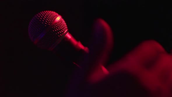 A Hand Touches To The Microphone On The Stage Rap Of Concert Footage