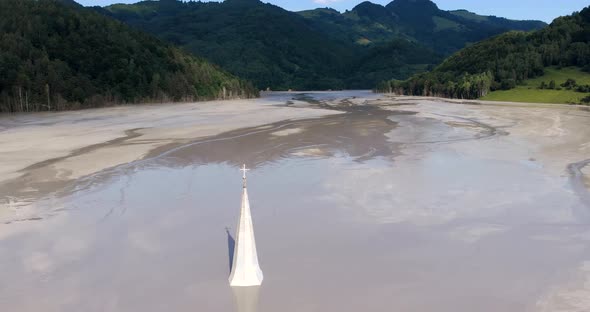 Church Spire Of The Sunken Geamana Village At The Middle Of The Toxic Lake At The Valley Of Romanian alt