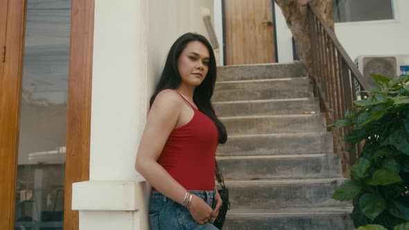 a Beautiful Trans Woman Looks at Camera alt