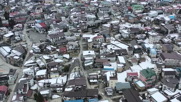 dense populated residential apartments in Japanese village of nozawa onsen, aerial alt