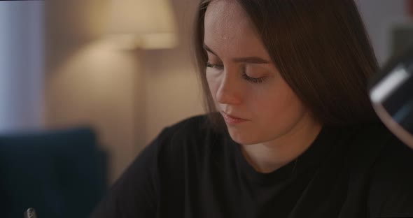 Selfeducation By Online Video Tutorials and Webinars Woman Is Making Notes and Viewing on Screen of alt