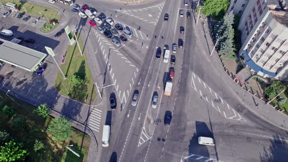 Drone Aerial View of Crossroad in Modern City in Rush Hour alt