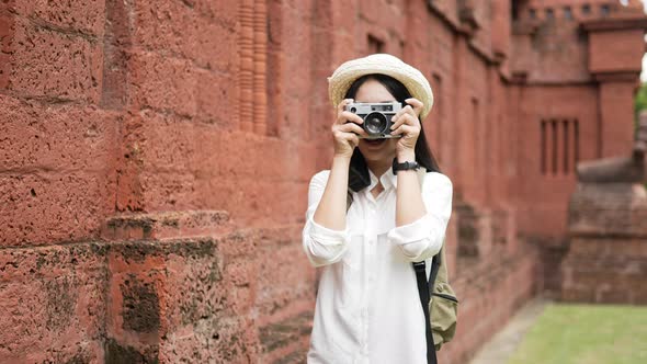 Woman visiting ancient temple alt