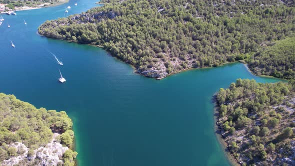 Flying over Krka river, autostrada and arch bridge at summer in Croatia, Europe alt
