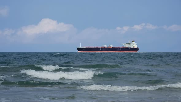 Oil Tanker Passing By on the Horizon. alt