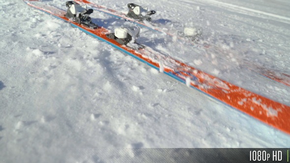 Skis Falling on Snow in Slow Motion alt