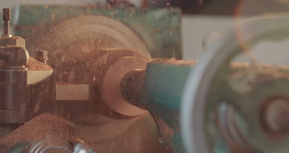 Man working on a wood lathe creating art - slow motion macro shot alt