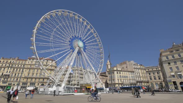 A Ferris Wheel in a city square alt