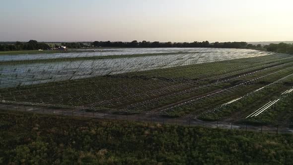 Aerial View of the Amazing Field with Racks for Solar Panels Construction alt