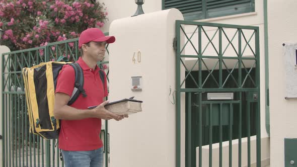 Courier Ringing Doorbell, Giving Package To Customer alt