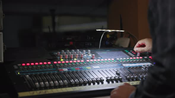 Radio Station Hand of Sound Engineer Uses a Music Mixer with Editing Tools in Production Studio alt