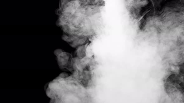 Soft fog in slow motion on dark background alt