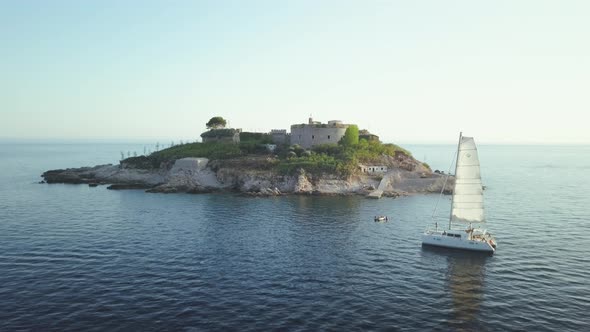 Aerial view of Yacht cruising on the sea or ocean in summer day in Montenegro alt
