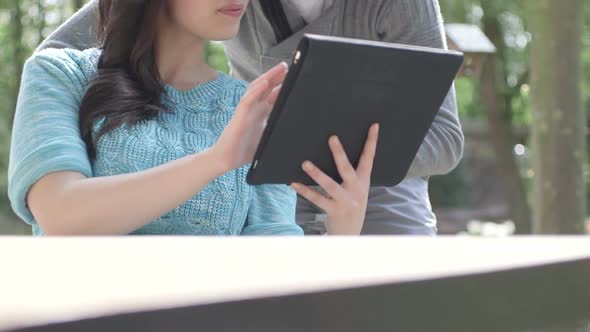 MS TU Couple using digital tablet and smiling / Breda, NoordBrabant, Netherlands