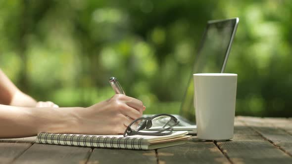 Creative Working On Laptop And Writing Ideas alt