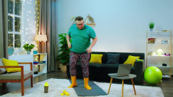 An Obese Man Is Doing Martial Arts in a Living alt