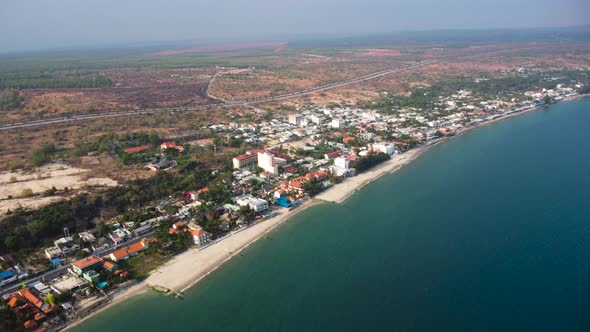 Geotextile Tubes Installed Along The Shore Of Mui Ne Beach Resort Town In Vietnam. - aerial alt