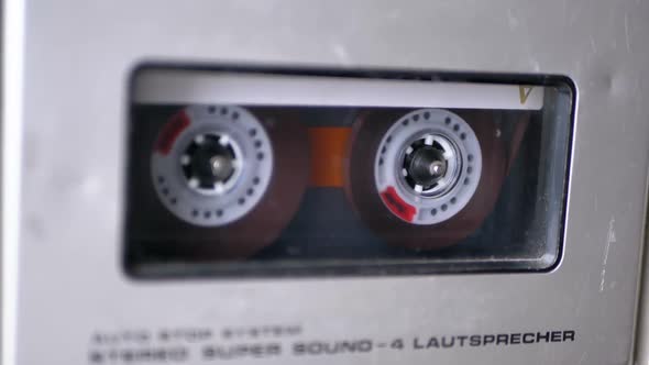 Audio Tape. Vintage Tape Recorder Plays Audio Cassette Inserted Therein alt