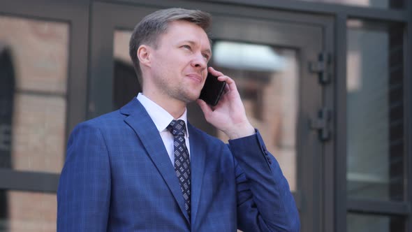 Phone Negotiation by Businessman alt