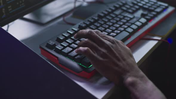 Unrecognizable Cyber Sportsman Using Computer Keyboard alt