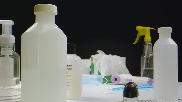 Macro Shot of Thermometer Gloves Mask and Sanitizers alt