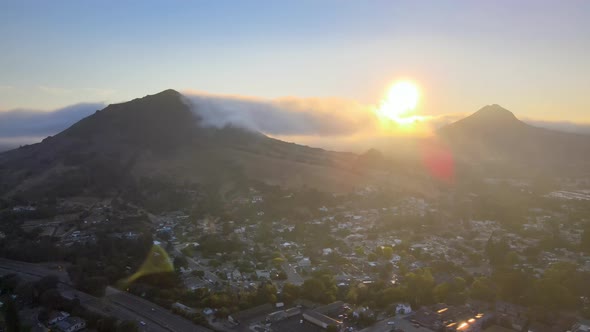 Aerial/Drone footage of sunset between mountains in San Luis Obispo, California