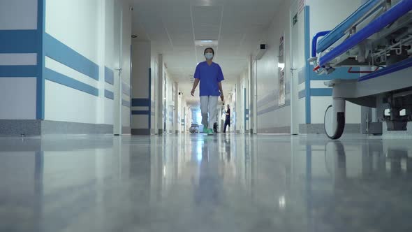 Female Doctor Walking in Hospital