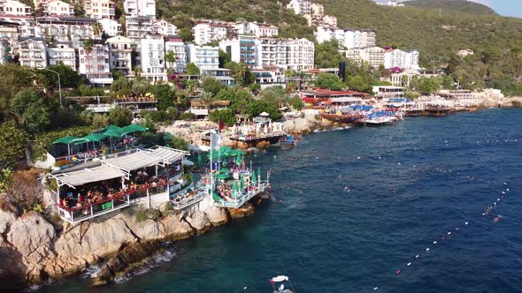 Beach on the Cliffs in the Kas City Center and People Swimming 4K alt