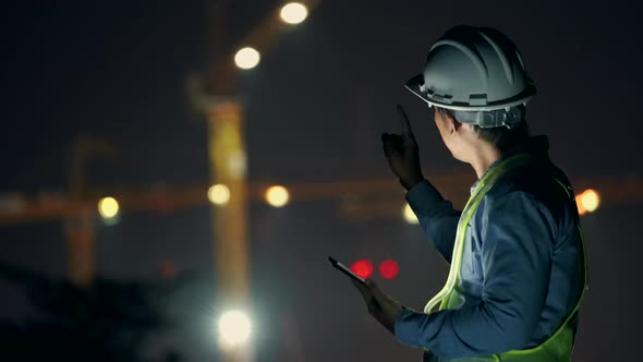 Civil field engineer check and inspection building work on site in night time