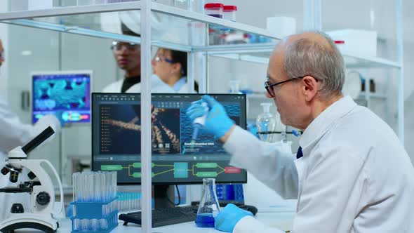 Microchemist Putting Liquid in Test Tube at Laboratory Using Micropipette alt