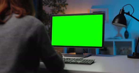 Woman Working on Green Screen Laptop