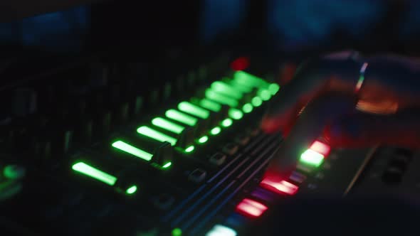 Closeup of Music Producer Working on Drum Machine alt