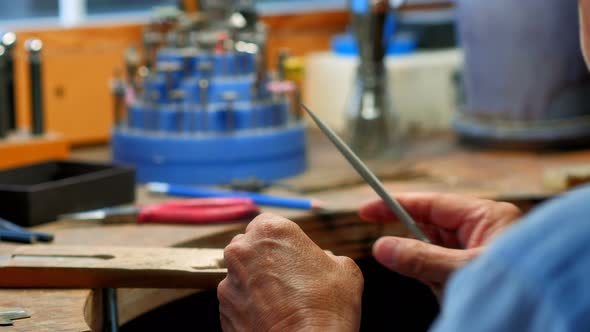 Craftswoman working in workshop alt