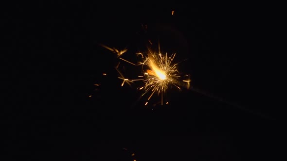 Sparks Of Sparkler Fly Around On A Black Background 2