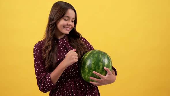 Cheerful Teen Girl Checking Quality of Water Melon Healthy Food