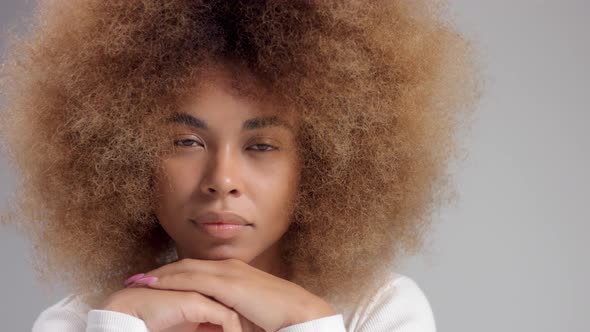 Mixed Race Black Woman with Big Afro in Studio Alone Slow Motion, Camera Moves