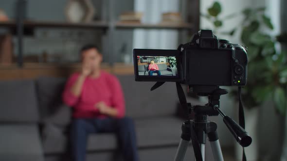 Hearing Impaired Male Vlogger Recording Video alt