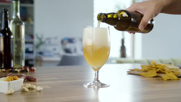 Pouring White Beer In To Glass
